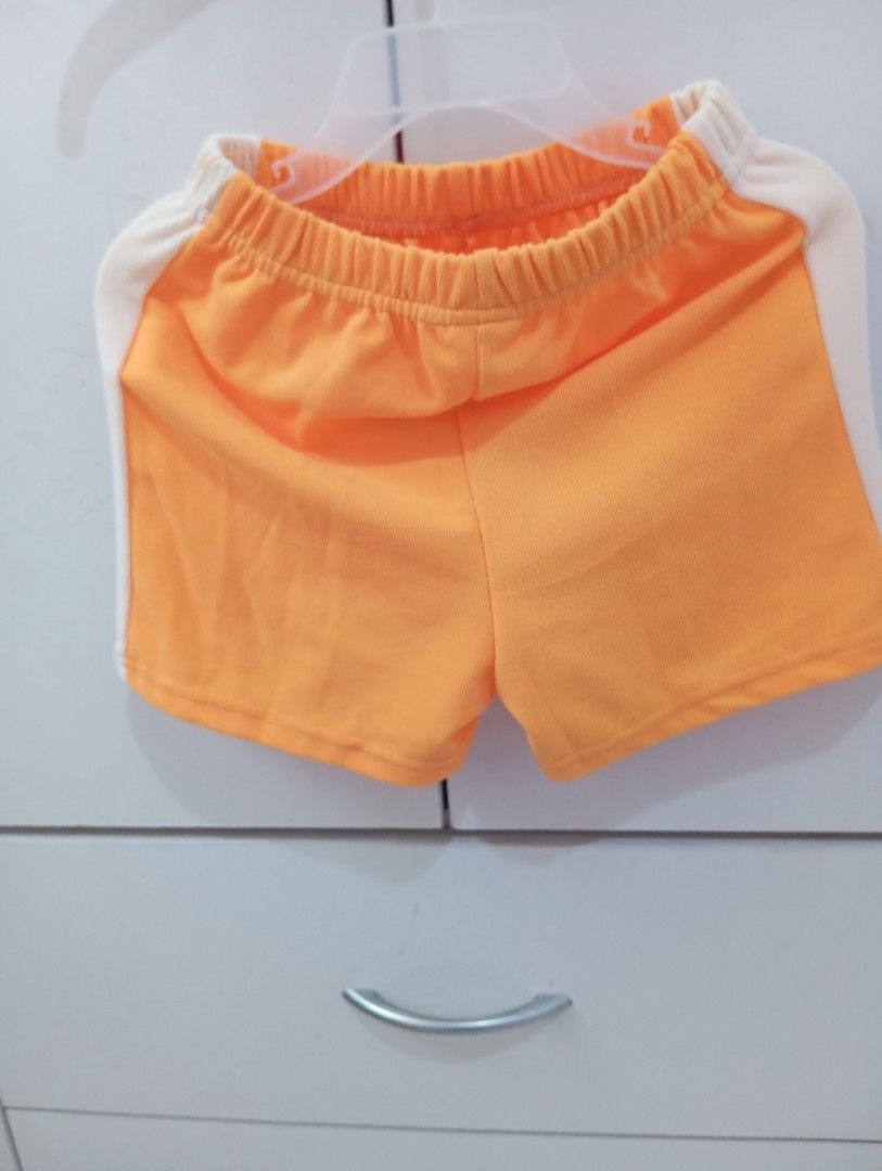 Hoodie terno and Shorts Set (Category: Babies & Kids Fashion) located in Manila. Submitted by brion123 (Listing ID 1462050581, Image 3). Description: - Adorable orange hoodie top with cream sleeves - Features a cute letter 'A' patch on the top - Matching orange shorts with stylish cream side stripes - Shorts have a comfortable elastic waistband - Ideal for casual outings and active playtime - Fun and sporty outfit for kids.