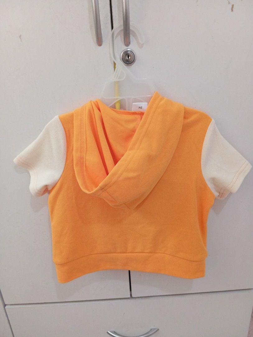 Hoodie terno and Shorts Set (Category: Babies & Kids Fashion) located in Manila. Submitted by brion123 (Listing ID 1462050581, Image 2). Description: - Adorable orange hoodie top with cream sleeves - Features a cute letter 'A' patch on the top - Matching orange shorts with stylish cream side stripes - Shorts have a comfortable elastic waistband - Ideal for casual outings and active playtime - Fun and sporty outfit for kids.