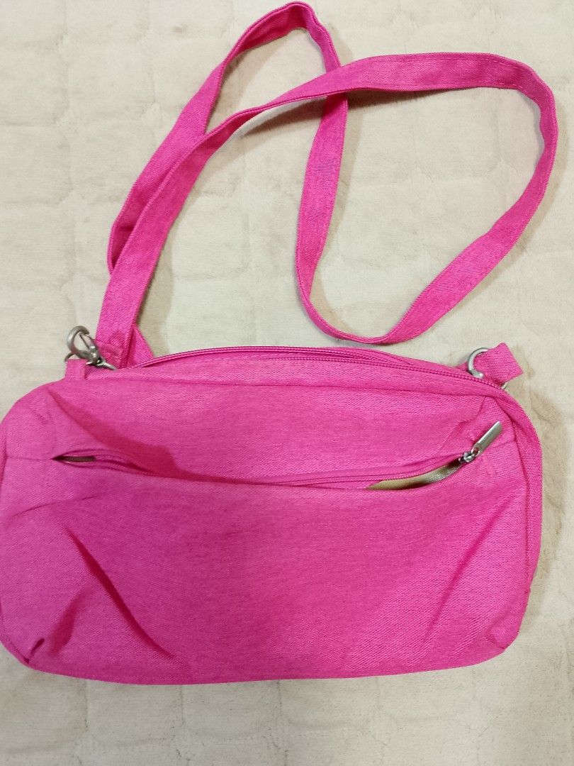Hot Pink Crossbody and shoulder bag (Category: Cross-body Bags) located in Caloocan City. Submitted by pvaliao (Listing ID 1462059821, Image 2). Description: Brand: Life VC Pre-owned Price: 150 pesos Size: 11 inches × 7 inches This is a small, hot pink fabric crossbody and shoulder bag with an adjustable strap and silver-tone metal hardware. Fabric: durable canvas woven fabric buy it now.