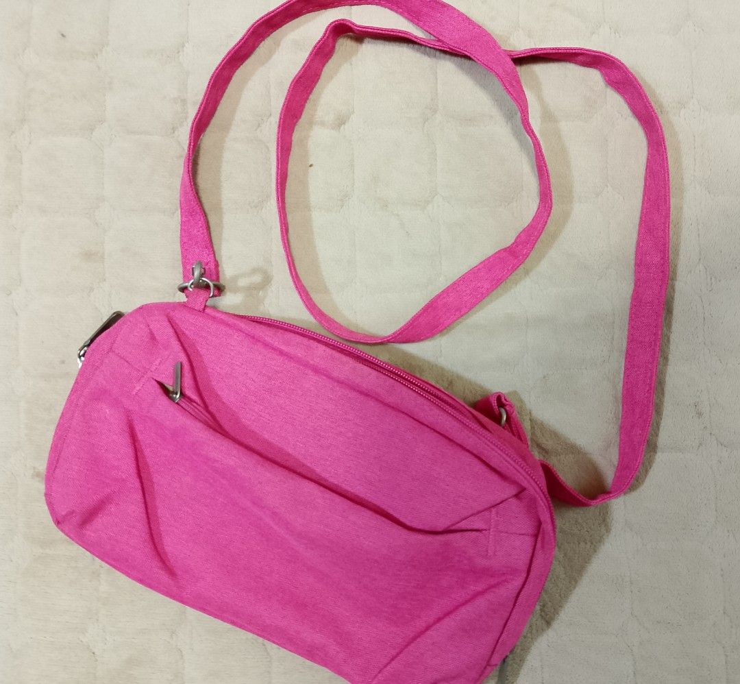 Hot Pink Crossbody and shoulder bag (Category: Cross-body Bags) located in Caloocan City. Submitted by pvaliao (Listing ID 1462059821, Image 1). Description: Brand: Life VC Pre-owned Price: 150 pesos Size: 11 inches × 7 inches This is a small, hot pink fabric crossbody and shoulder bag with an adjustable strap and silver-tone metal hardware. Fabric: durable canvas woven fabric buy it now.