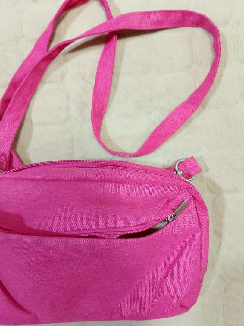Hot Pink Crossbody and shoulder bag (Category: Cross-body Bags) located in Caloocan City. Submitted by pvaliao (Listing ID 1462059821, Image 3). Description: Brand: Life VC Pre-owned Price: 150 pesos Size: 11 inches × 7 inches This is a small, hot pink fabric crossbody and shoulder bag with an adjustable strap and silver-tone metal hardware. Fabric: durable canvas woven fabric buy it now.
