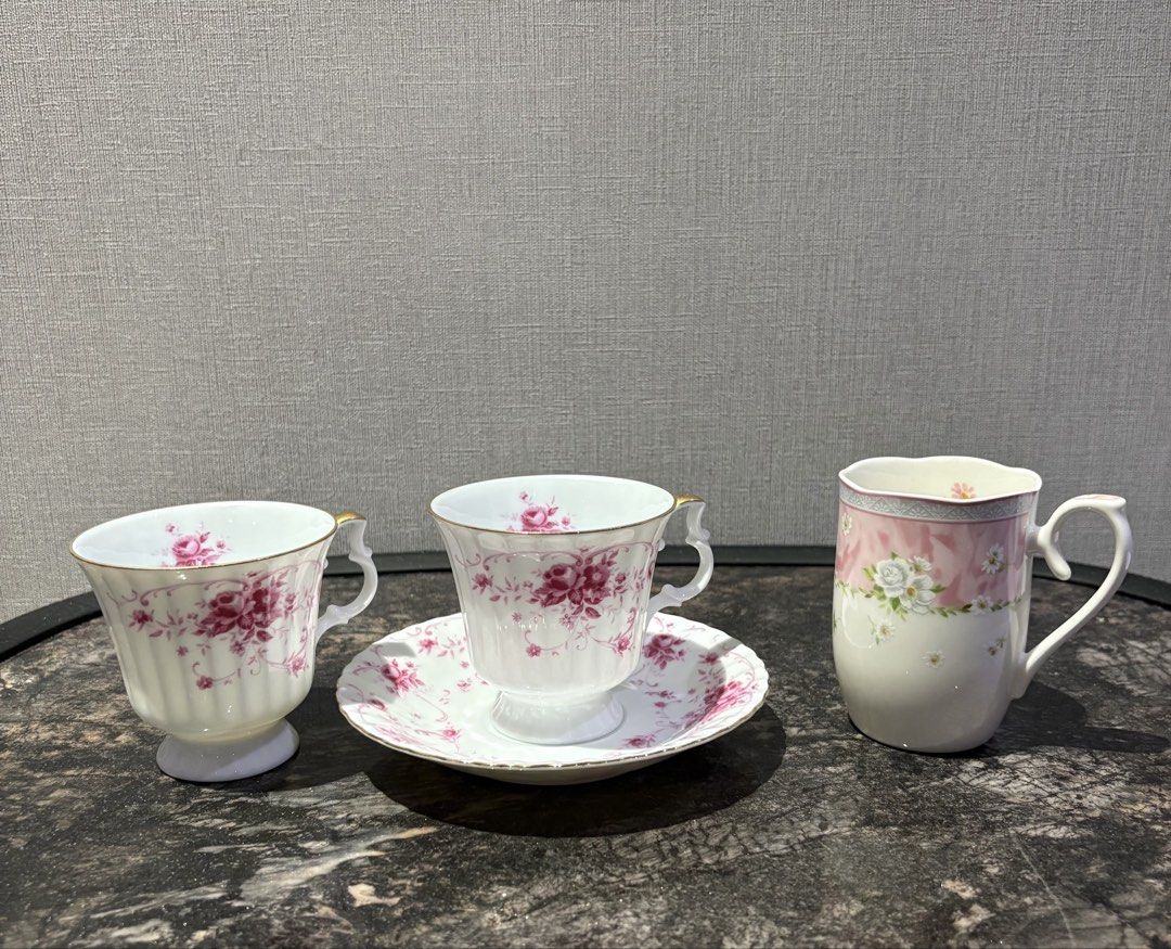 Hoya Bundle: 2 Cups, 1 Saucer, 1 Mini Mug (Category: Coffee & Tea Tableware) located in Manila. Submitted by foundhouseph (Listing ID 1462223364, Image 1). Description: - Set includes 2 cups, 1 saucer, 1 mini mug -Price:199php for all -Features a delicate pink floral design. - One cup is a mug style, two are traditional teacups. - One teacup comes with a matching saucer. - Ideal for tea parties, afternoon tea, or decorative display..