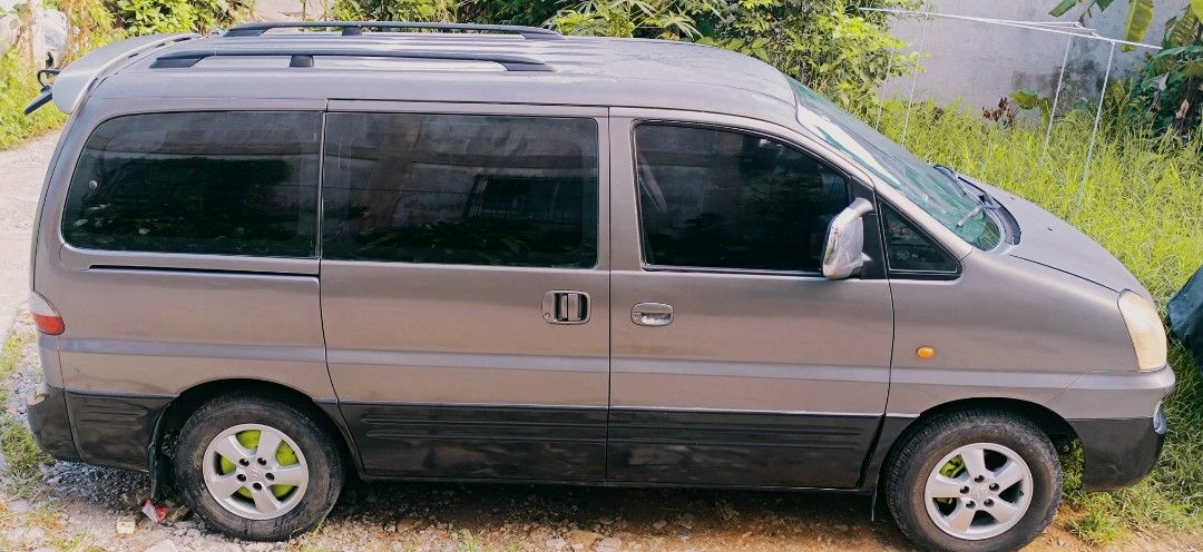 Hyundai Starex (Category: Used Cars) located in Tagaytay City. Submitted by tamala16 (Listing ID 1462260569, Image 1). Description: For Sale Hundai Starex GRX TCI 2004 AT Near Tagaytay city Market Nego upon viewing - 9 Seaters - Commuter Van - D4BH engine - 2.5L DOHC 16-valve inline-4 - Ice Cold AC - All Lights working - Dashcam front and back - 2din touch screen monitor - All stock Original - Good Underchasis - Good engine/transmission - Power w