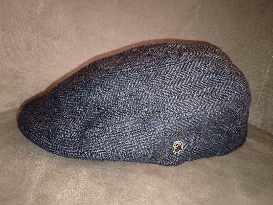 Jaxon Hats Blue Herringbone Wool Blend Ivy / Flat Cap Size Large (Category: Caps & Hats) located in Binangonan. Submitted by yuristalin888 (Listing ID 1462261177, Image 2). Description: This classic flat cap by Jaxon Hats features a sophisticated **blue-and-black herringbone tweed pattern** crafted from a **durable wool blend**. It comes fully lined with a **quilted satin interior** for enhanced comfort and warmth during cooler weather, and is fi