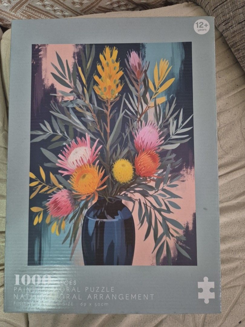 Jigsaw Puzzle (Category: Other Stationery & Craft) located in Manila. Submitted by matthew34567 (Listing ID 1462112990, Image 1). Description: - 1000-piece jigsaw puzzle - Features a beautiful painted floral arrangement - Finished size: 69cm x 50cm - Recommended for ages 12 and up - Ideal for a relaxing hobby or as wall art.