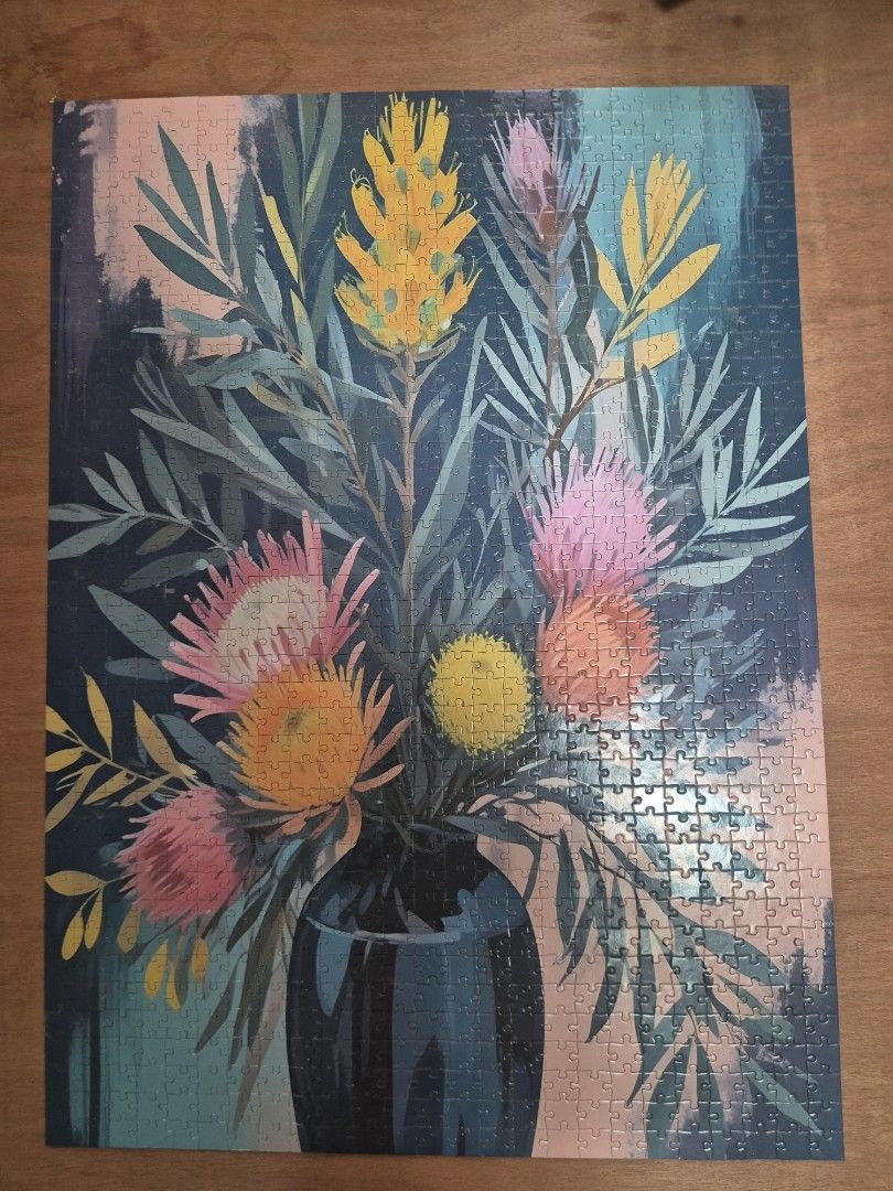 Jigsaw Puzzle (Category: Other Stationery & Craft) located in Manila. Submitted by matthew34567 (Listing ID 1462112990, Image 2). Description: - 1000-piece jigsaw puzzle - Features a beautiful painted floral arrangement - Finished size: 69cm x 50cm - Recommended for ages 12 and up - Ideal for a relaxing hobby or as wall art.