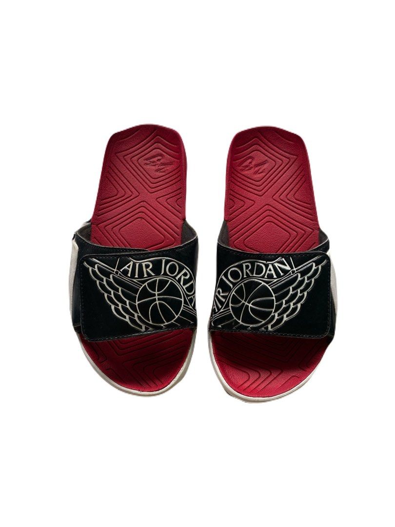 Jordan Air Slides Black Red Size (Category: Slippers & Slides) located in Cagwait. Submitted by roundsociety_ph (Listing ID 1462223847, Image 1). Description: - Authentic Jordan Air Slides - Classic Black and Red colorway - Prominent Jordan logo on strap - Red sole with grip pattern for traction - Size: 4Y (US Youth) / 36 (EUR) / 23 CM - Ideal for everyday casual wear or post-game relaxation - Made in China.