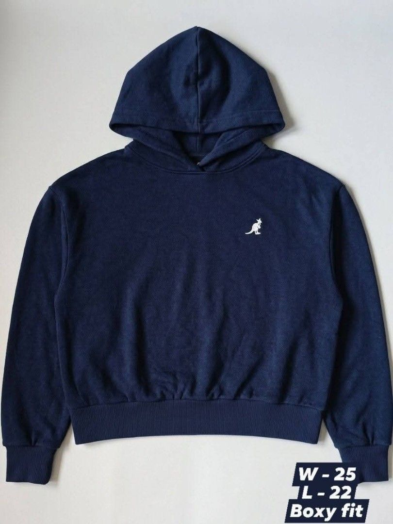 Kangol Navy Blue Hoodie (Category: Coats, Jackets and Outerwear) located in Quezon City. Submitted by rezno (Listing ID 1462257935, Image 2). Description: - Navy blue Kangol hoodie - Classic kangaroo logo on the front - Large 'KANGOL' text and 'Born British, Raised on the streets of New York.' graphic on the back - Boxy fit - Estimated size: W-25 L-22.