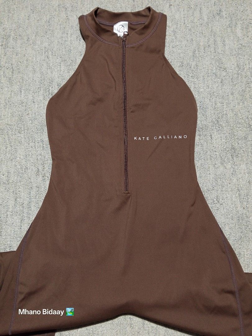 Kate Galliano Active Jumpsuit Brown Quick Drying (Category: Jumpsuits) located in Valencia. Submitted by mhano_bidaay_outdoors_218 (Listing ID 1462199515, Image 3). Description: - Brand: Kate Galliano - Color: Brown - Style: Active Jumpsuit - Features: Quick-drying fabric, zip front, cutout back - Measurements: Chest 13.5", Waist to hem 29", Inseam 24.5", Full length 49" - Size: Medium/Large - Condition: Excellent.