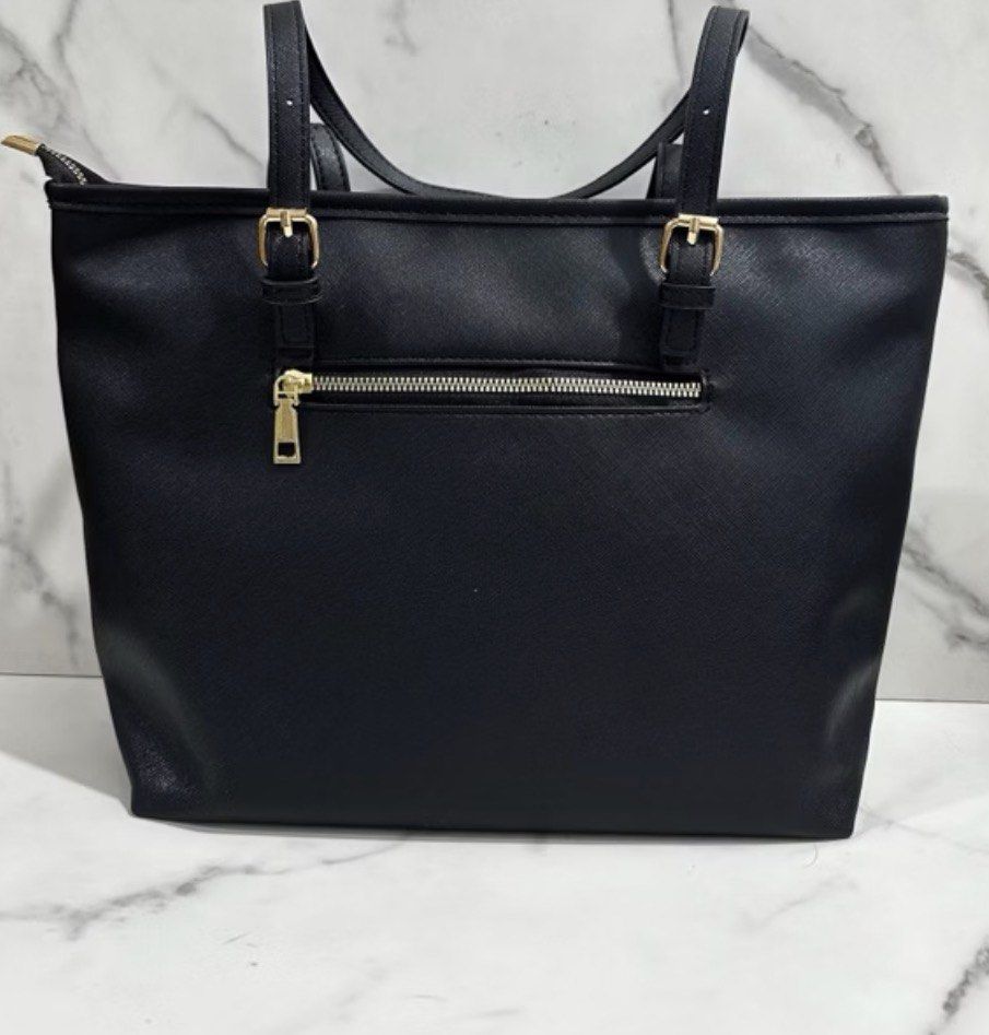 Kate Spade Bag (Category: Tote Bags) located in Pasig City. Submitted by ilmsf (Listing ID 1462166470, Image 3). Description: - Like new - Used Twice only - Classic black tote bag from Kate Spade New York - Convenient zip pocket on the back exterior - Ideal for everyday essentials and professional use .