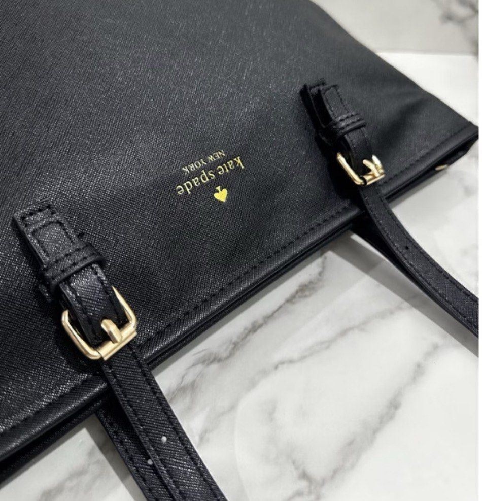 Kate Spade Bag (Category: Tote Bags) located in Pasig City. Submitted by ilmsf (Listing ID 1462166470, Image 2). Description: - Like new - Used Twice only - Classic black tote bag from Kate Spade New York - Convenient zip pocket on the back exterior - Ideal for everyday essentials and professional use .