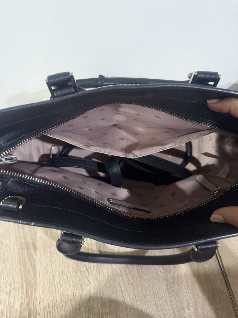 Kate Spade Black Leather Handbag (Category: Luxury Bags & Wallets) located in Paranaque City. Submitted by kaina1849240 (Listing ID 1462218001, Image 1). Description: - Genuine black leather Kate Spade handbag - Interior features a stylish patterned lining - Secure zipper closure - Comfortable top handles - Includes a detachable strap for versatile carrying - Ample interior space for all your essentials - Ideal for everyday use and stylish on-the