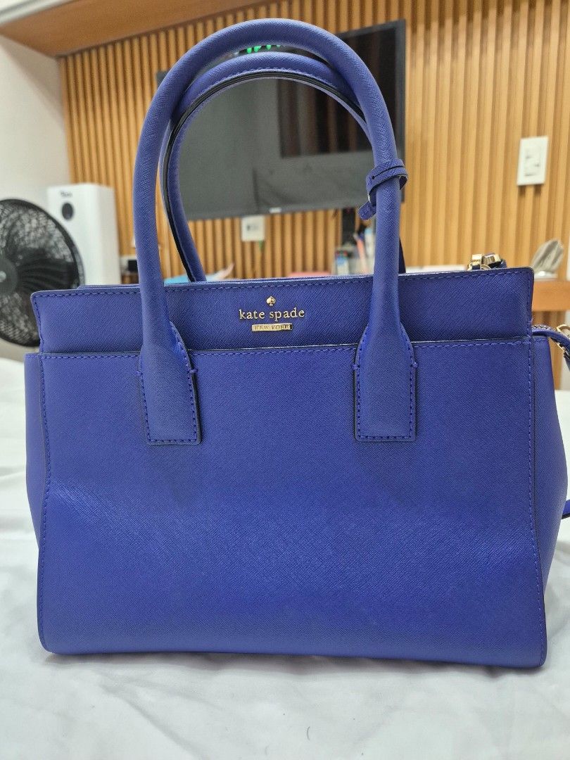 Kate Spade Blue Leather Top Handle Bag with Shoulder Strap (Category: Luxury Bags & Wallets) located in Manila. Submitted by bajoyskie (Listing ID 1462140459, Image 1). Description: Original pre loved - Vibrant blue Kate Spade handbag - Textured leather material - Dual top handles - Detachable shoulder strap included - Interior lined with black and white stripes - One interior zippered pocket - Elegant gold hardware details - Classic and function