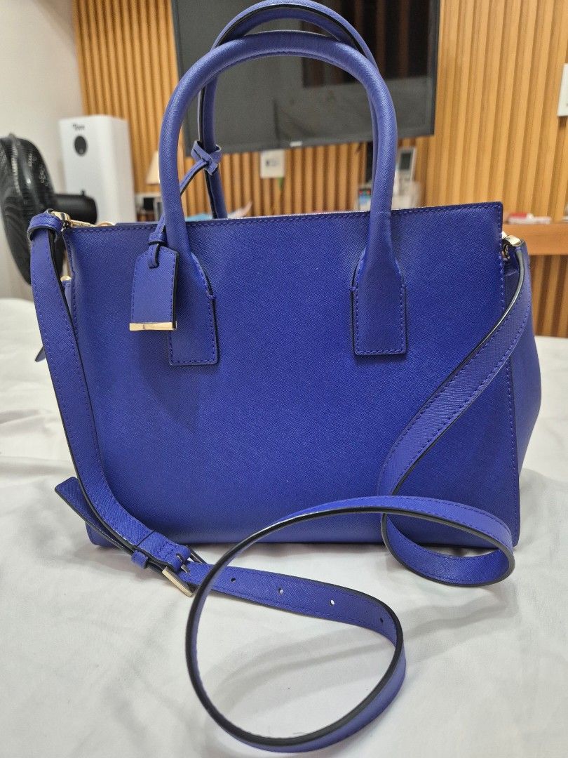 Kate Spade Blue Leather Top Handle Bag with Shoulder Strap (Category: Luxury Bags & Wallets) located in Manila. Submitted by bajoyskie (Listing ID 1462140459, Image 2). Description: Original pre loved - Vibrant blue Kate Spade handbag - Textured leather material - Dual top handles - Detachable shoulder strap included - Interior lined with black and white stripes - One interior zippered pocket - Elegant gold hardware details - Classic and function