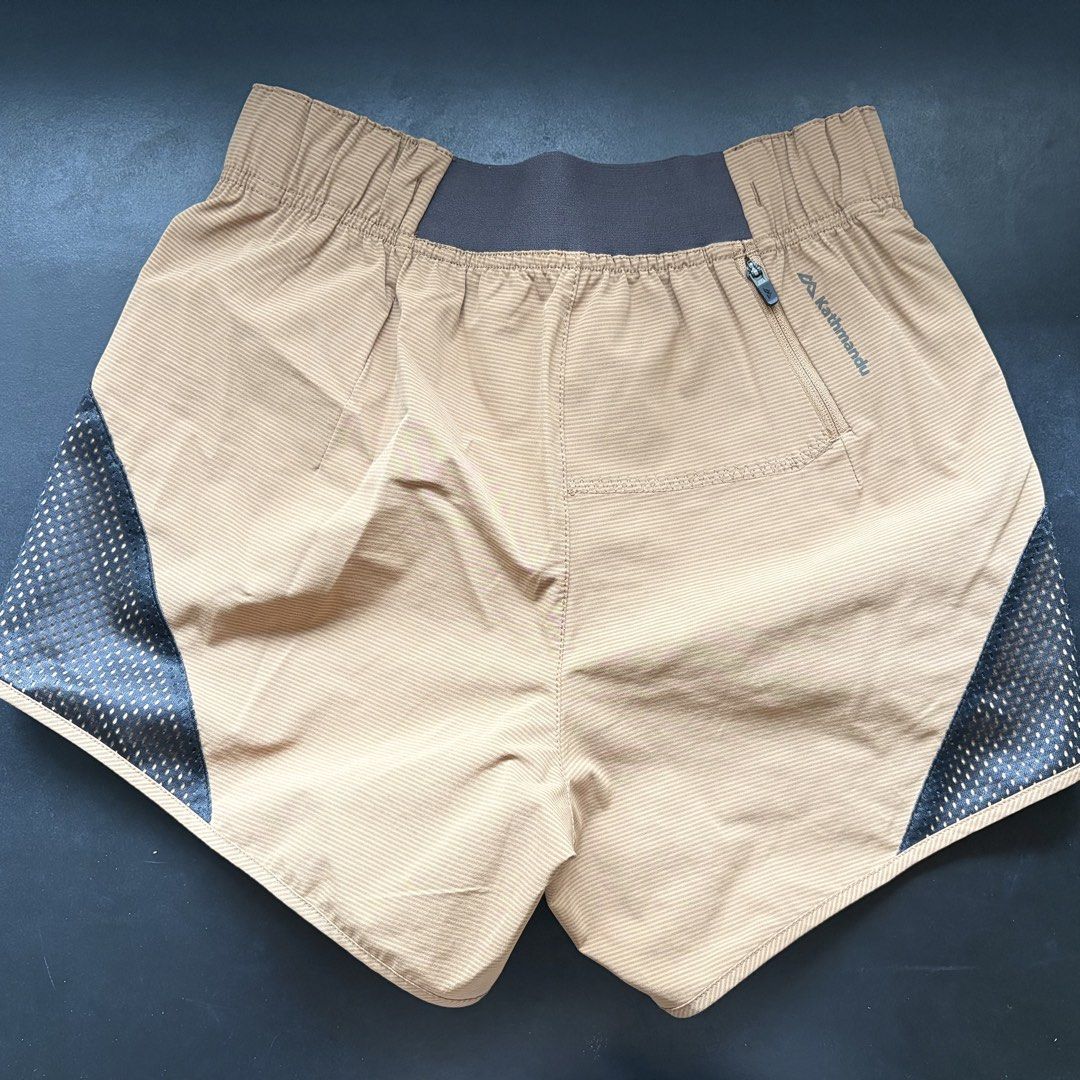 Kathmandu Running Shorts (Category: Shorts) located in Marikina City. Submitted by arci.things (Listing ID 1462078499, Image 3). Description: - striped tan color with side splits - bought from NZ - rarely used, like new! - can fit asian xxs-xs - moisture wicking - with small back zip pocket .