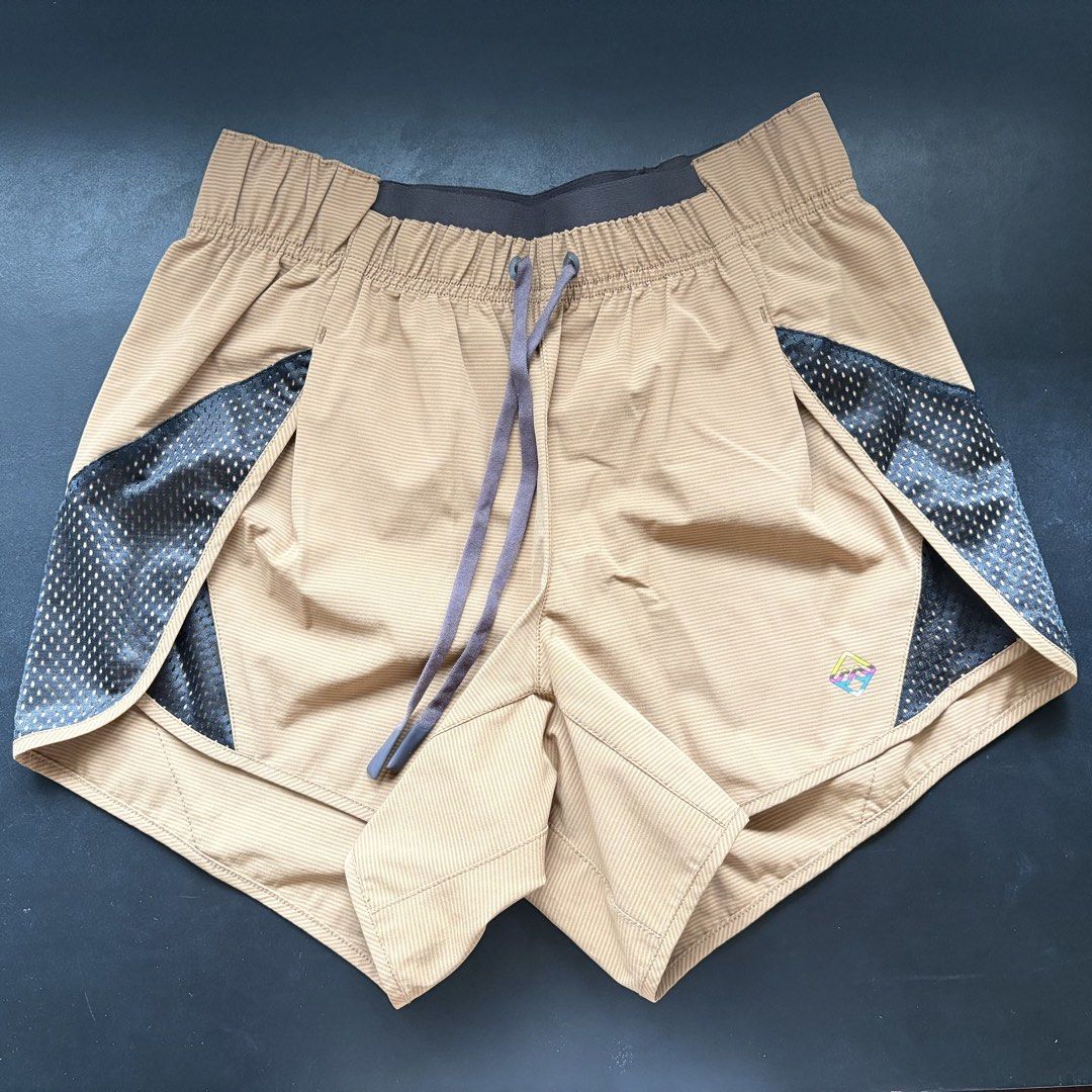 Kathmandu Running Shorts (Category: Shorts) located in Marikina City. Submitted by arci.things (Listing ID 1462078499, Image 2). Description: - striped tan color with side splits - bought from NZ - rarely used, like new! - can fit asian xxs-xs - moisture wicking - with small back zip pocket .