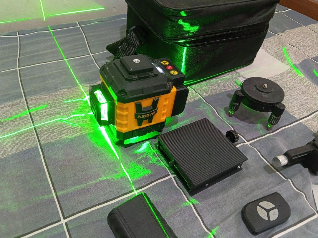 KEELAT Line Laser Level Green Beam (Category: Home Improvement Tools & Accessories) located in Quezon City. Submitted by wads_ (Listing ID 1462057006, Image 2). Description: - KEELAT Laser Level with green lines. - Includes: Remote control, charger, battery, and mounting bracket. - Comes with a carrying case (note: case has some wear and tear on the side). - Ideal for all your construction and home improvement projects..