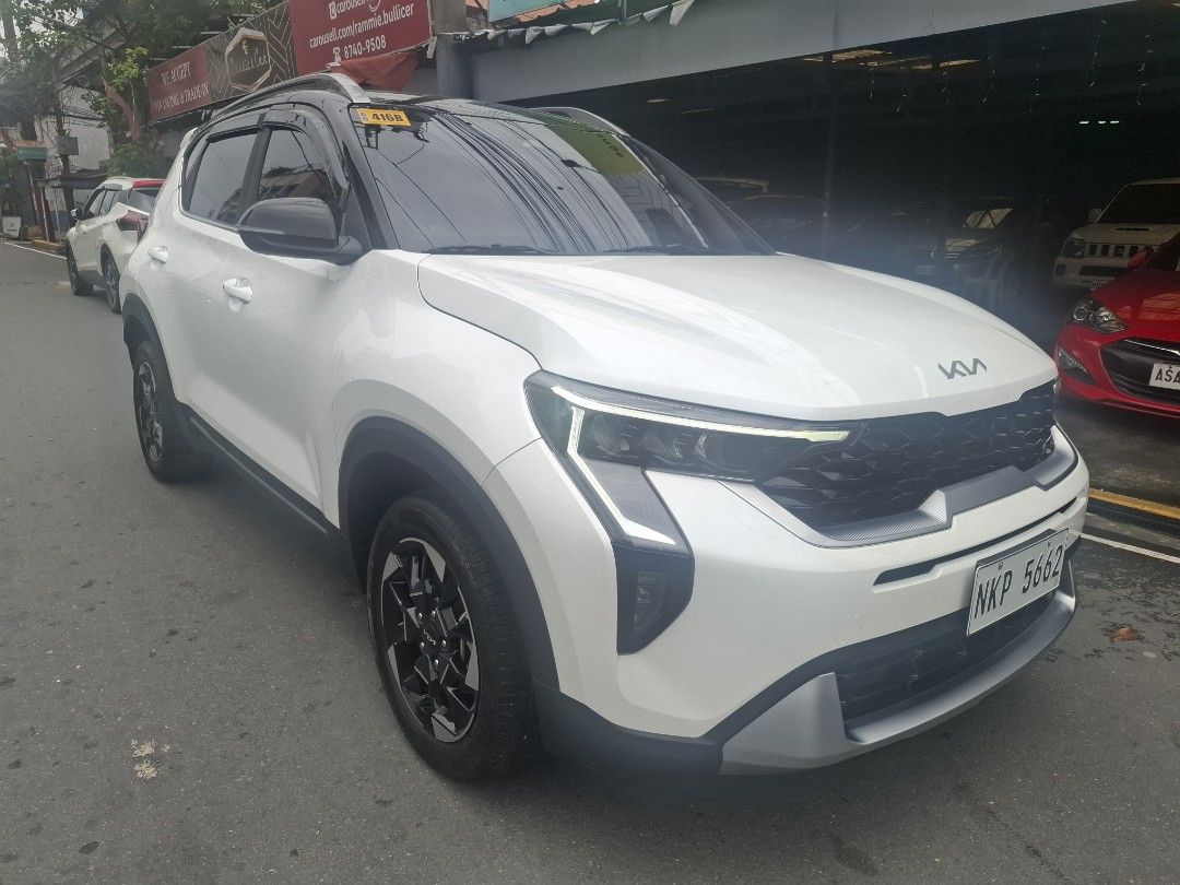 Kia Sonet SX Auto (Category: Used Cars) located in Manila. Submitted by rammie.bullicer (Listing ID 1462056649, Image 1). Description: 🚘 Kia Sonet SX 2025 🚘 ‼️865k (negotiable)‼️ ✔️ 1st Owned ✔️ Top of the Line ✔️ Automatic Transmission ✔️ Push Start with 2 OEM Smart Keys ✔️ OEM Biege Leather seats ✔️ Sun Roof ✔️ Bnew deep dish Matting ✔️ 10k Original Mileage casa Maintained ✔️ Bnew Trunk Tray ✔️ Bnew Wide Rear View Mirror ✔️ Bnew Sun/Rain Viso