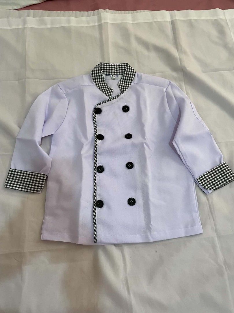 Kids Chef Uniform Set - White Jacket and Gingham Pants (Category: Babies & Kids Fashion) located in Makati City. Submitted by primadonna00 (Listing ID 1462261434, Image 3). Description: - Adorable chef uniform for kids - White double-breasted jacket with black buttons and gingham trim - Matching gingham pants with elastic waistband - Ideal for dress-up and imaginative play - Estimated size for children aged 5-7 years (check measurements for best 