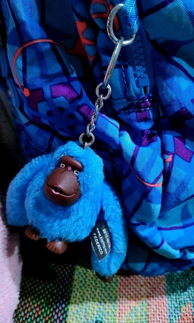 Kipling Backpack - Blue Geometric Pattern with Monkey Charm (Category: Backpacks) located in Baliuag. Submitted by marieannfernando23 (Listing ID 1462143268, Image 3). Description: - Medium 16 x 11" - Adorable Kipling backpack - Fun blue geometric pattern with orange dinosaur figures - Comes with the signature Kipling monkey charm - Zippers are in excellent working condition - Spacious interior, perfect for school or everyday essentials - Versati