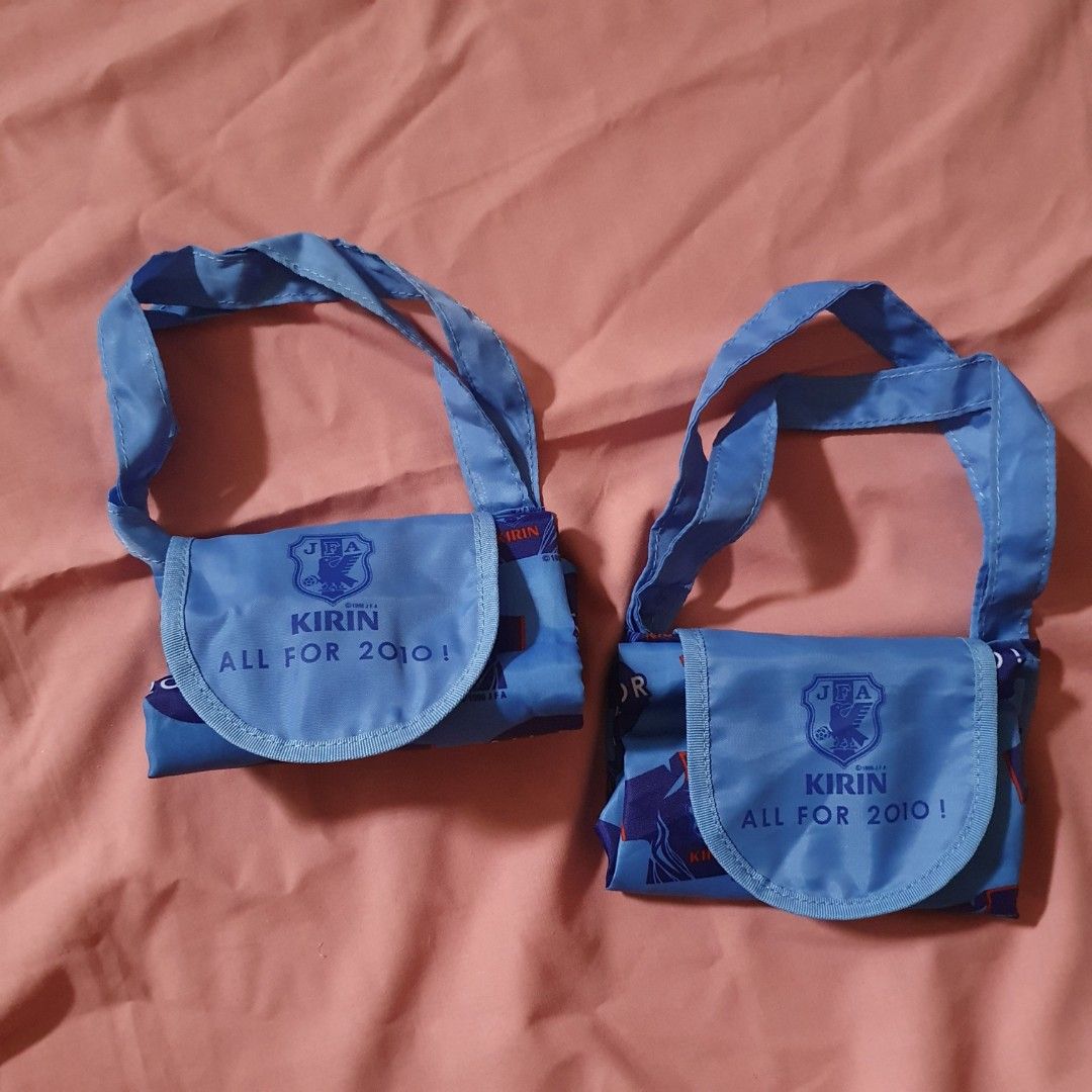 Kirin JFA All For 2010 Blue Reusable Shopping Bag bundle (Category: Tote Bags) located in Paranaque City. Submitted by cobien (Listing ID 1462188881, Image 3). Description: - Set of 2 blue reusable shopping bags - Features a fun 'Kirin All For 2010!' and football jersey pattern - Ideal for groceries, shopping, or everyday use - Folds up neatly for easy storage - Excellent value for both bags.