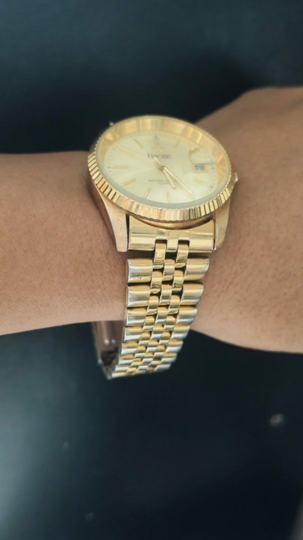 Klaese Gold Tone Watch with Date Window (Category: Women's Watches) located in Taguig. Submitted by mercyeugen28914 (Listing ID 1462132031, Image 3). Description: - Gold tone watch from Klaese - Classic design with fluted bezel - Date window at 3 o'clock - Two-tone gold and silver bracelet - In good working condition.