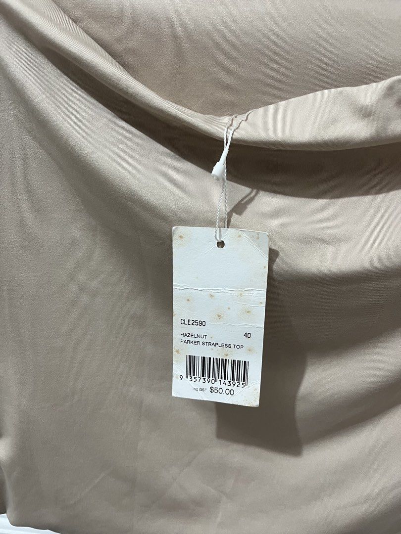 KOOKAI Hazelnut Strapless Top AU 12 / FR 40 (Category: Sleeveless) located in Pili. Submitted by jhamimin22 (Listing ID 1462149213, Image 3). Description: - Kookai strapless top - Hazelnut color - Size: AU 12 / FR 40 - Brand new with original tag attached (RRP $50.00) - Made in Sri Lanka - Simple and chic design - Perfect for layering or wearing on its own -Medium to Large.