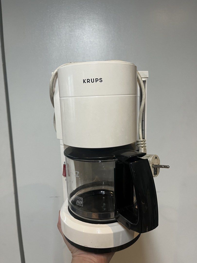 Krups Coffee Maker - White (Category: Coffee Machines & Makers) located in Makati City. Submitted by apwellloved (Listing ID 1462047721, Image 1). Description: - White Krups coffee maker - Includes glass carafe - Brews 2-7 cups - Easy on/off switch - Tested and working.