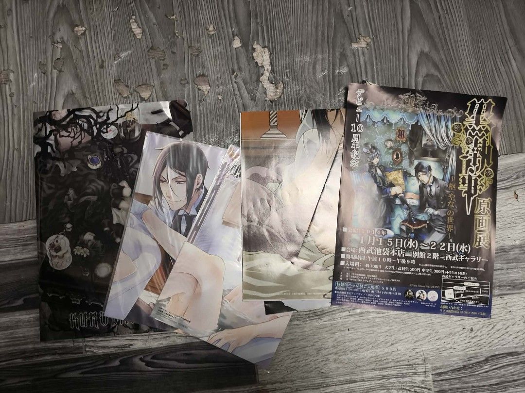 Kuroshitsuji Art Book & Posters Set (Category: Art & Prints) located in Quezon City. Submitted by victorald25831 (Listing ID 1462171325, Image 2). Description: - Set of Kuroshitsuji art prints and a small art book. - Features popular characters like Ciel Phantomhive and Sebastian Michaelis. - Comes with a clear folder to protect the art prints. - Please note: Some slight creasing on the edges of the posters. - Ideal for any Black Butler fan!.