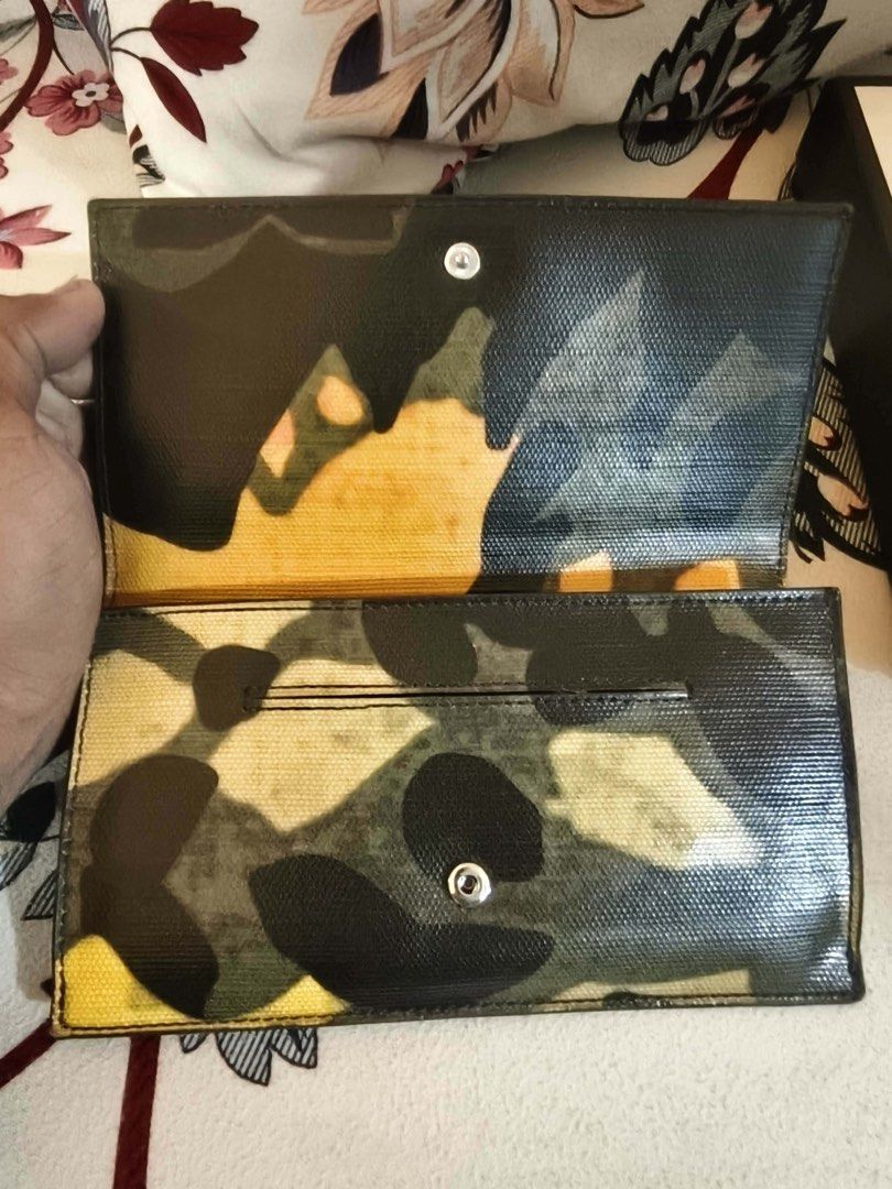 Lacoste Camouflage Wallet (Category: Wallets & Card holders) located in Taguig. Submitted by vanityandstuffbyelena (Listing ID 1462096367, Image 3). Description: ALL AUTHENTIC -Cool camouflage design from Lacoste - Multiple card slots and cash compartment - Shiny, textured exterior finish - Secure snap closure - Shows some signs of wear, but still functional.
