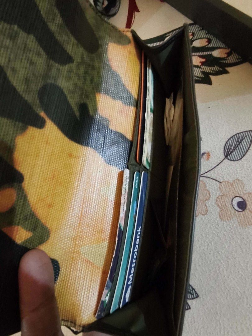 Lacoste Camouflage Wallet (Category: Wallets & Card holders) located in Taguig. Submitted by vanityandstuffbyelena (Listing ID 1462096367, Image 2). Description: ALL AUTHENTIC -Cool camouflage design from Lacoste - Multiple card slots and cash compartment - Shiny, textured exterior finish - Secure snap closure - Shows some signs of wear, but still functional.