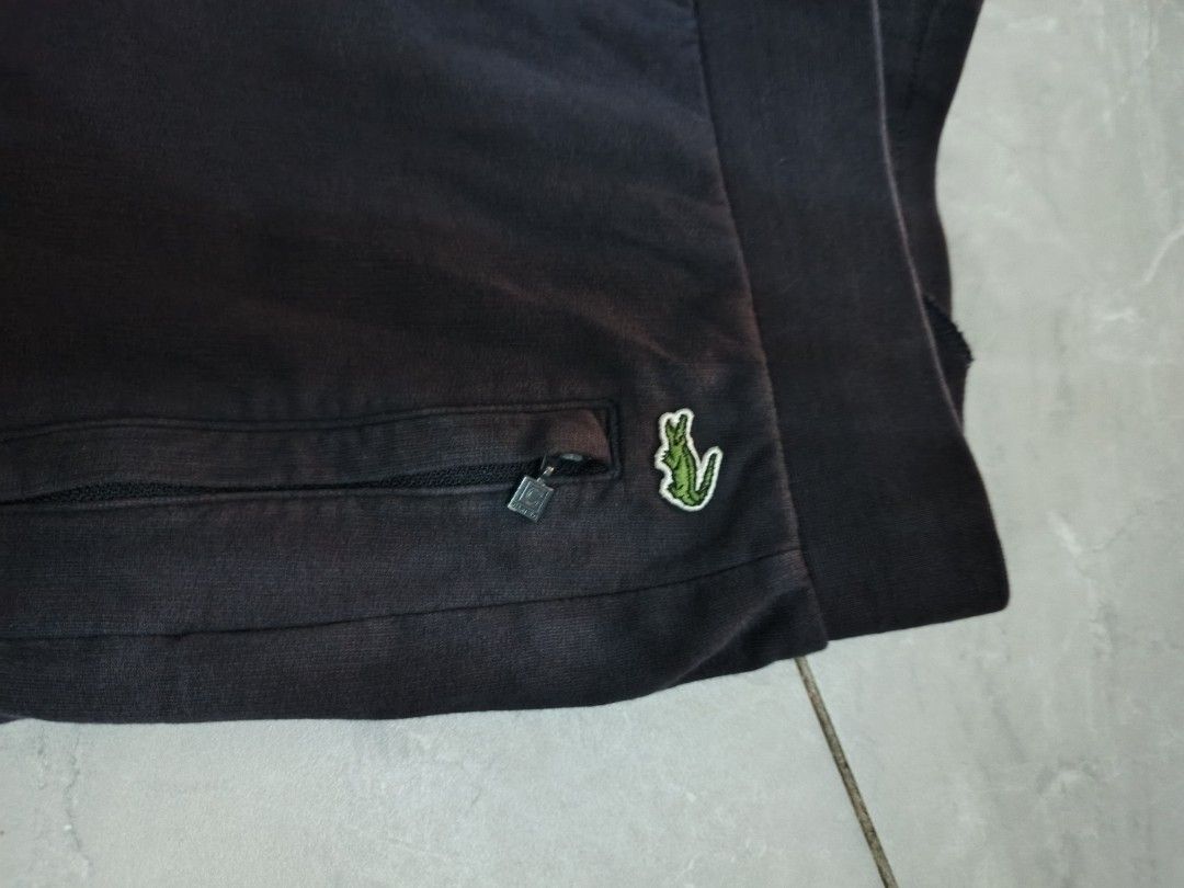 Lacoste Cartelo Sweatpants Size M (Category: Other Bottoms) located in Bulacan. Submitted by gratsy (Listing ID 1462049252, Image 2). Description: Lacoste Cartelo. Elastic waistband with drawstring. Two zippered pockets on the front. Small embroidered crocodile logo on the right pocket. Size M (160/68A). Made of 100% cotton. gift lang sa anak ko..