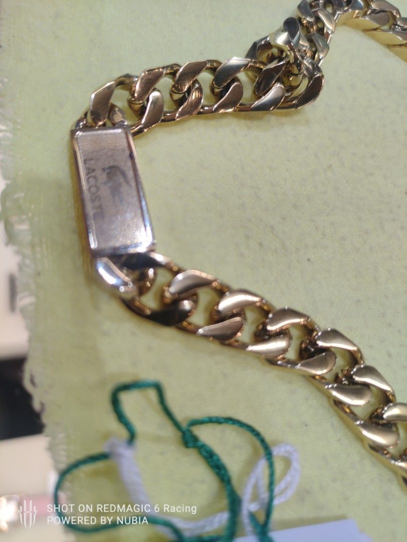 Lacoste Gold Chain Necklace (Category: Necklaces) located in Manila. Submitted by alfredaguirre0819 (Listing ID 1462066496, Image 2). Description: - Authentic Lacoste gold chain and silver necklace - Features iconic crocodile logo on a plaque - Includes original box and tags - Purchased from Landers Superstore - A stylish and great accessory 20k neg location arca south taguig or pasay newport.