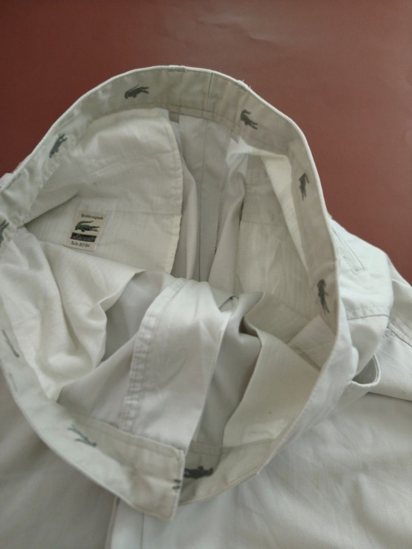 LACOSTE Men's Chino Shorts Med (Category: Shorts) located in Cebu City. Submitted by little_mush.room (Listing ID 1462090385, Image 3). Description: - preloved Classic beige chino shorts from Lacoste - Iconic crocodile logo on front pocket and back - Pleated front design - Button and zip closure - Size: medium measurements posted.