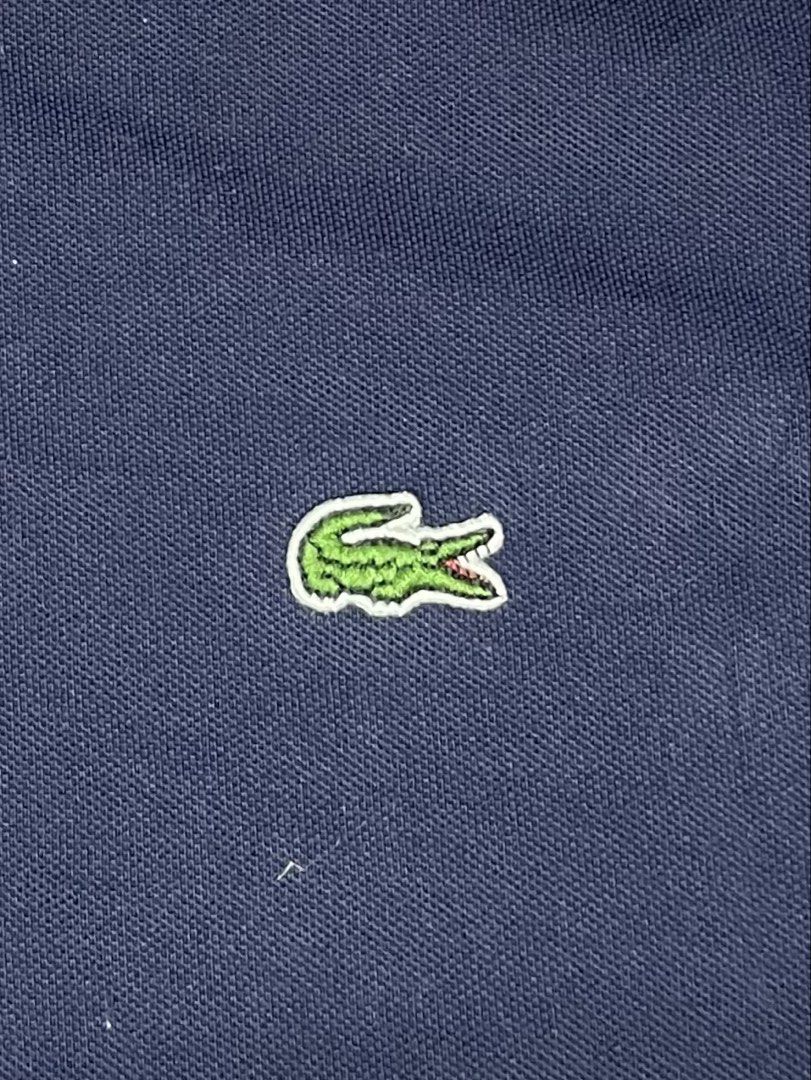 Lacoste Navy Blue Polo Shirt (Category: Tshirts & Polo Shirts ) located in Manila. Submitted by josephowns53408 (Listing ID 1462121857, Image 3). Description: Classic navy blue Lacoste polo shirt Width 21” X Length 24” .