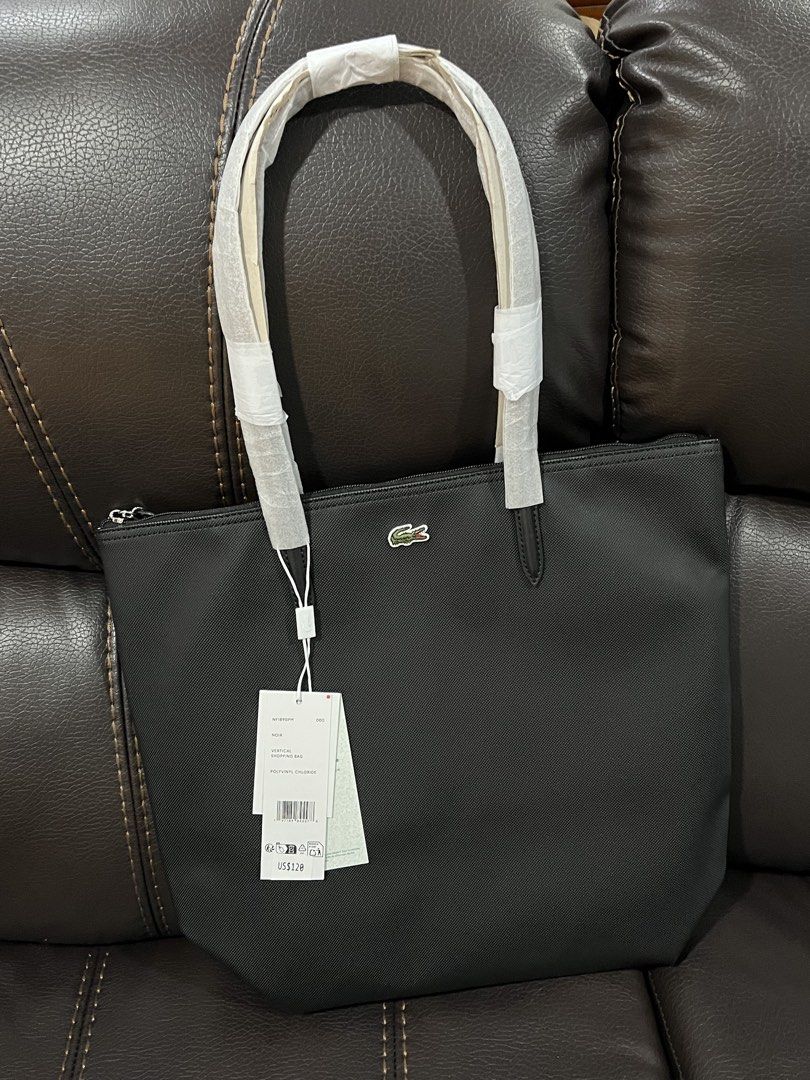 Lacoste NF1890PM Vertical Tote Bag Noir (Category: Tote Bags) located in Pasig City. Submitted by moom1nt (Listing ID 1462044125, Image 2). Description: - Authentic Black Lacoste Vertical Tote - Condition: Brand new with original tags attached - Original Retail Price: US$120 - Got this in the US.