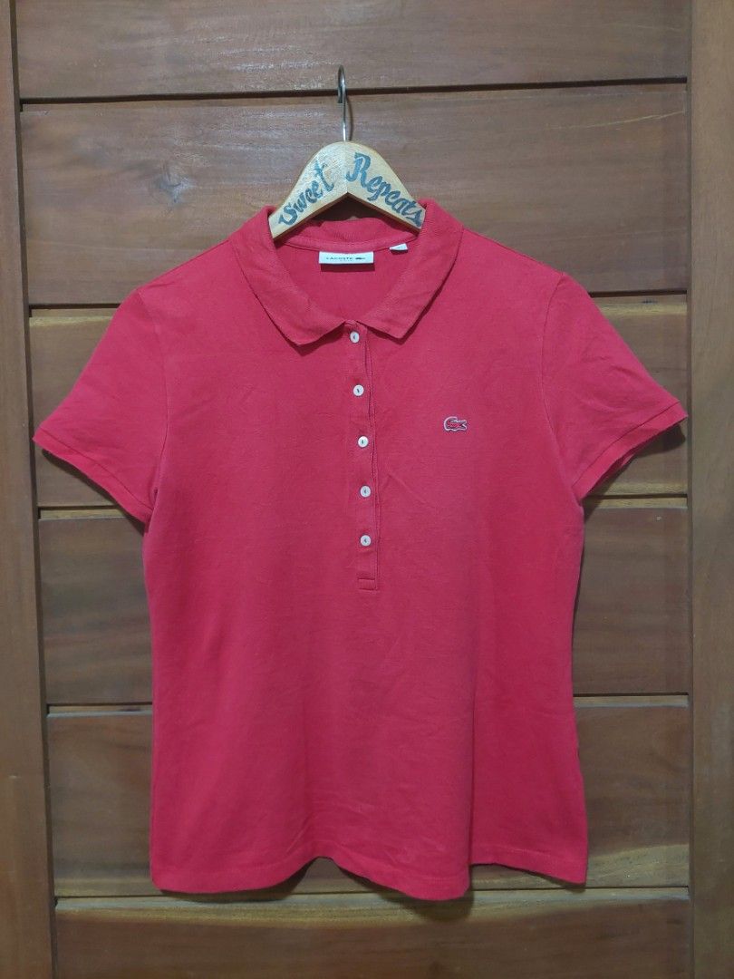 Lacoste Red Polo Shirt (Category: Others Tops) located in Bagac. Submitted by sweet_repeats2021 (Listing ID 1462175702, Image 1). Description: - Red Lacoste Polo Shirt - Size: M - Fit: Slim fit - Features: Classic crocodile logo on chest, button-up neckline - Style: Perfect for casual or smart casual occasions.