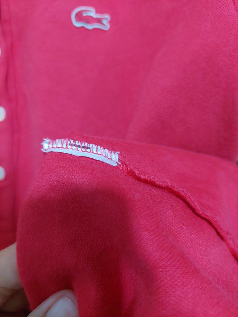 Lacoste Red Polo Shirt (Category: Others Tops) located in Bagac. Submitted by sweet_repeats2021 (Listing ID 1462175702, Image 3). Description: - Red Lacoste Polo Shirt - Size: M - Fit: Slim fit - Features: Classic crocodile logo on chest, button-up neckline - Style: Perfect for casual or smart casual occasions.