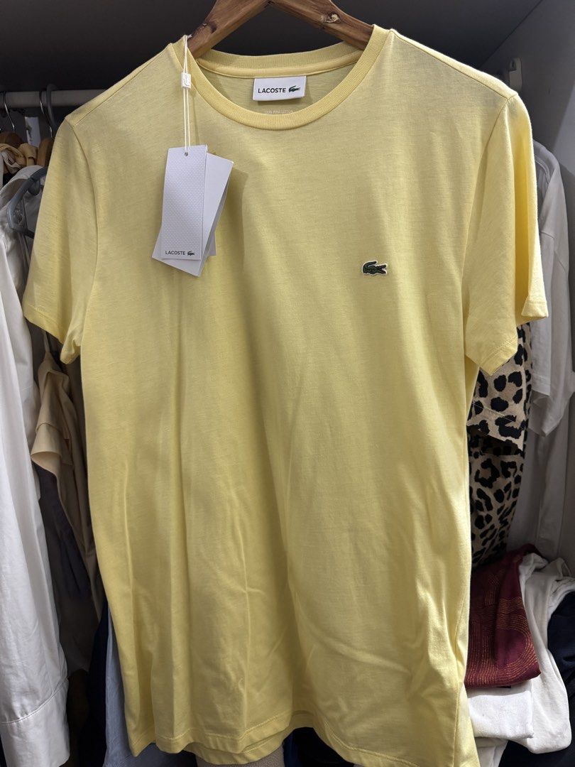 Lacoste Regular Fit T-Shirt (Category: Tshirts & Polo Shirts ) located in Manila. Submitted by chickonuggs (Listing ID 1462094193, Image 1). Description: - Brand: Lacoste - Fit: Regular - Size: S - Condition: Brand new with tags attached Rfs: declutter.