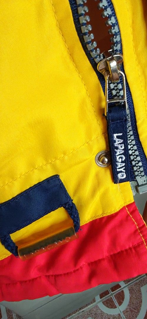 LAPAGAYO HOLLAND ACTIVE WEAR Colourful Jacket (Category: Coats, Jackets and Outerwear) located in Mandaluyong City. Submitted by trisha_001 (Listing ID 1462231870, Image 3). Description: - Vintage LAPA GAYO ACTIVE WEAR jacket - Eye-catching bright yellow with red and navy blue panels - Features unique graphic prints all over - "Authentic LAPA GAYO ACTIVE WEAR" graphic on back - "Feel Fresh Active Wear" and "Holland LAPA GAYO ACTIVE WEAR" graphics