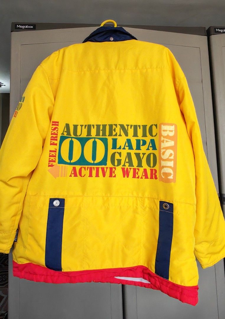 LAPAGAYO HOLLAND ACTIVE WEAR Colourful Jacket (Category: Coats, Jackets and Outerwear) located in Mandaluyong City. Submitted by trisha_001 (Listing ID 1462231870, Image 2). Description: - Vintage LAPA GAYO ACTIVE WEAR jacket - Eye-catching bright yellow with red and navy blue panels - Features unique graphic prints all over - "Authentic LAPA GAYO ACTIVE WEAR" graphic on back - "Feel Fresh Active Wear" and "Holland LAPA GAYO ACTIVE WEAR" graphics