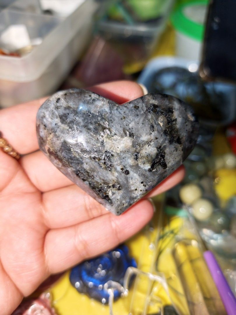 Larvikite Heart Carving Natural Crystal Stone (Category: Precious Stones) located in Quezon City. Submitted by piaoliangcollections.ph (Listing ID 1462223362, Image 1). Description: Larvikite is a dark igneous rock with a silver-blue shimmer that crystal practitioners value for grounding, mental focus, and energetic protection.