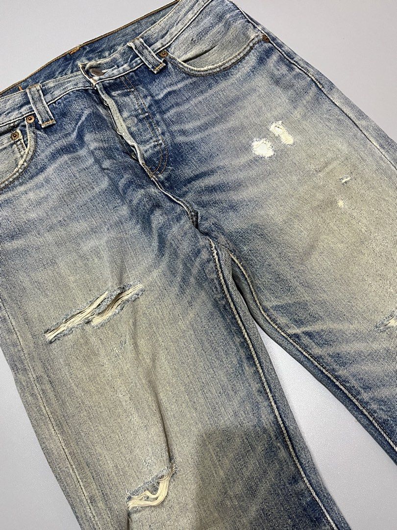 Levi's 501 Button Fly Distressed Denim Jeans (Category: Jeans) located in Manila. Submitted by jorgemabelin2001 (Listing ID 1462050786, Image 3). Description: - Classic Levi's 501 jeans - Light blue wash with intentional distressing and fading - Button fly closure - Rips and wear on knees and thighs - Frayed hem - Vintage/rugged aesthetic - Shows character from previous wear -Dimes 30x41.5 -Hem 7.5 .
