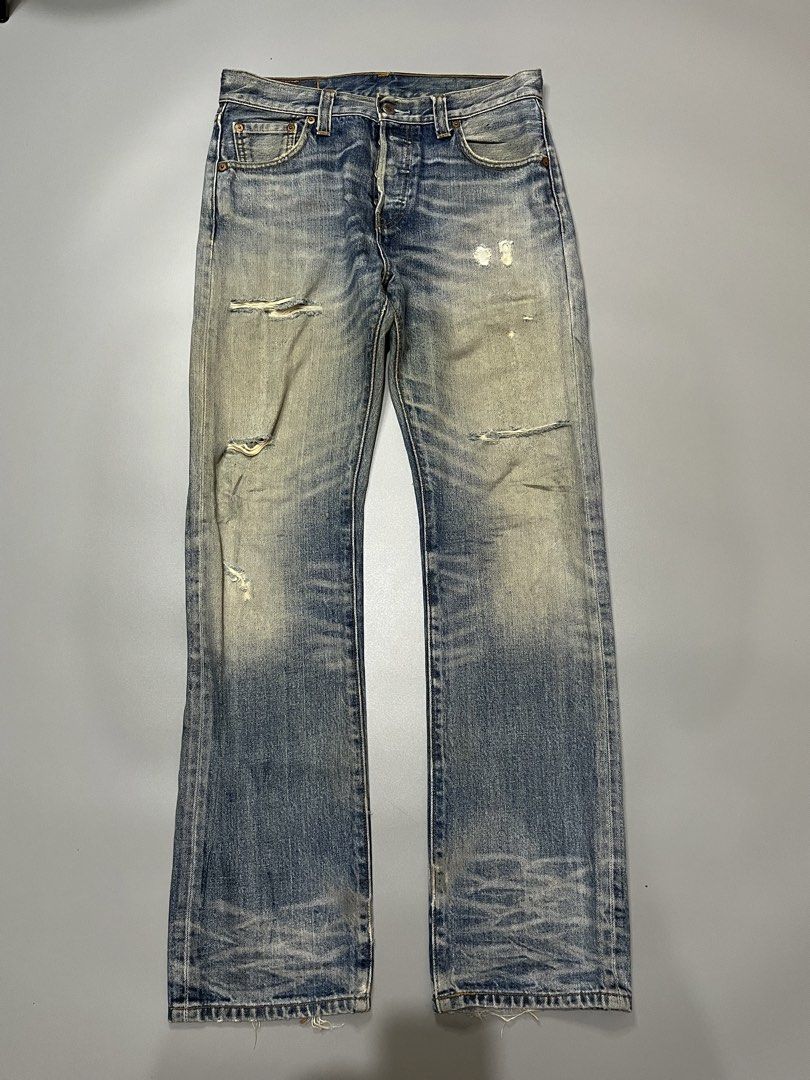 Levi's 501 Button Fly Distressed Denim Jeans (Category: Jeans) located in Manila. Submitted by jorgemabelin2001 (Listing ID 1462050786, Image 1). Description: - Classic Levi's 501 jeans - Light blue wash with intentional distressing and fading - Button fly closure - Rips and wear on knees and thighs - Frayed hem - Vintage/rugged aesthetic - Shows character from previous wear -Dimes 30x41.5 -Hem 7.5 .