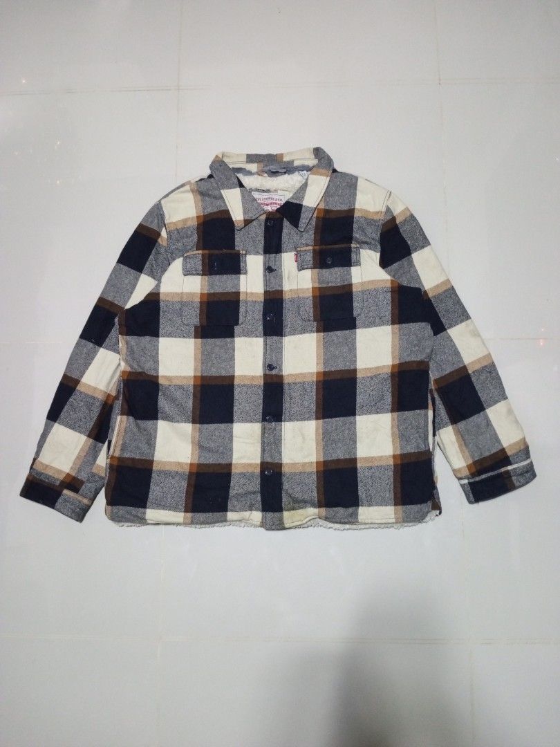 Levi's Plaid Sherpa Lined Jacket Size 2XL (Category: Coats, Jackets and Outerwear) located in Magdalena. Submitted by magdalenathrift20 (Listing ID 1462173558, Image 3). Description: - Brand: Levi's - Size: 2XL - Style: Warm jacket with plaid pattern - Features: Sherpa lining for extra coziness, button-up front, chest pockets - Ideal for: Cooler weather - Measurements: Width 27-28 inches, Length 30.5 inches.