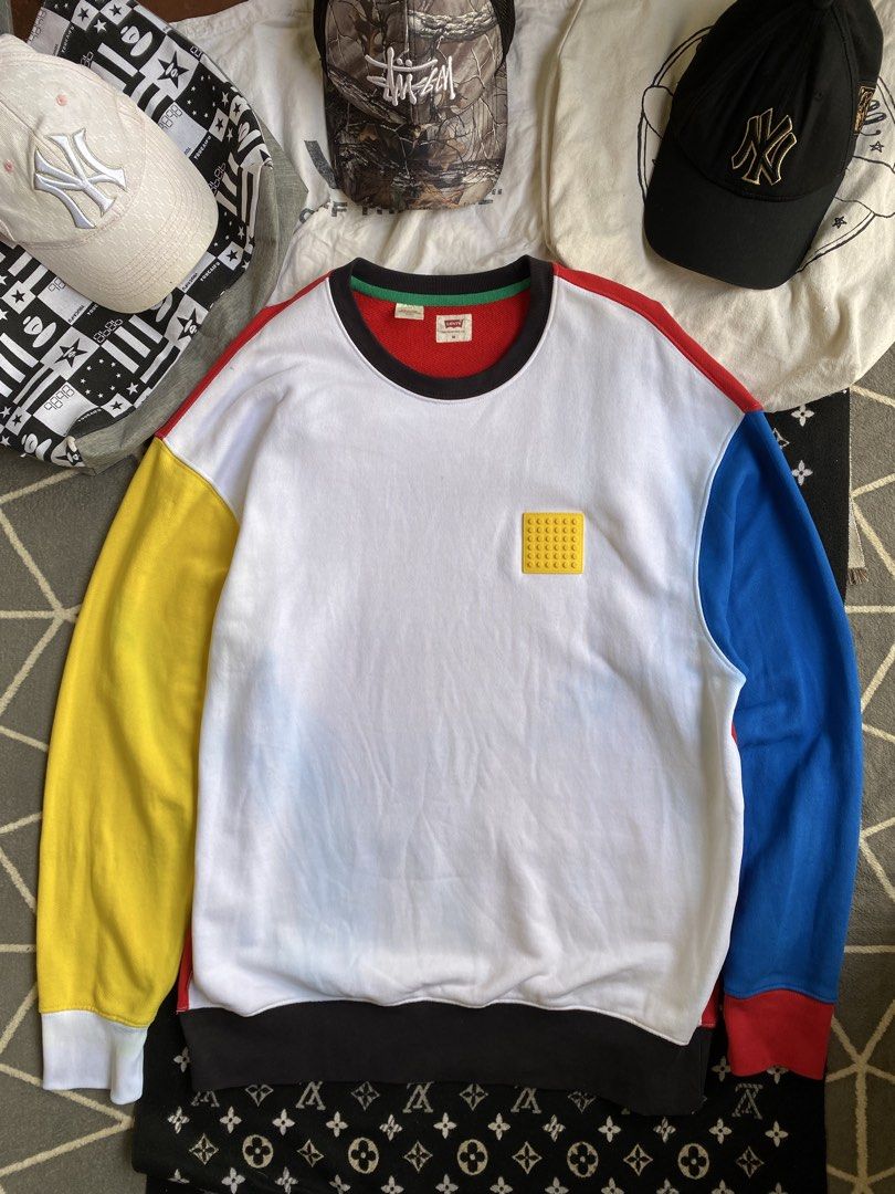 Levi's x LEGO Colorblock Sweatshirt (Category: Coats, Jackets and Outerwear) located in Manila. Submitted by thriftfindnicarl (Listing ID 1462048261, Image 1). Description: - Authentic Levi's x LEGO collaboration sweatshirt. - Eye-catching colorblock design: white body with vibrant yellow, blue, and red sleeves. - Subtle yet cool LEGO brick detail embroidered on the chest. - Comfortable ribbed cuffs and hem for a snug fit. - Ideal for everyday ca