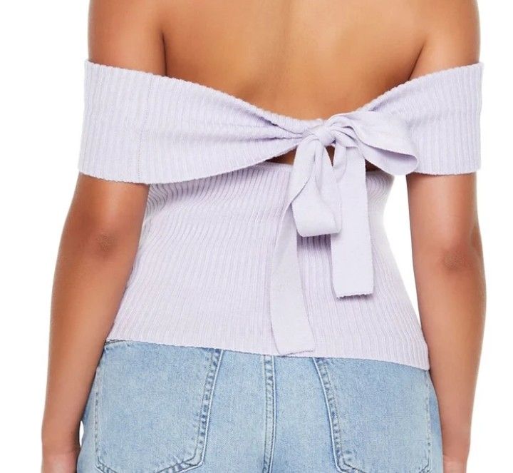 Lilac Off-Shoulder Ribbed Knit Top with Bow Back (Category: Blouses) located in Manila. Submitted by zealfish_7401a9 (Listing ID 1462080706, Image 2). Description: - Super cute lilac color - Off-shoulder design - Ribbed knit material for a comfy fit - Adorable tie bow detail at the back - Pairs perfectly with jeans or skirts - Ideal for casual days or a night out.