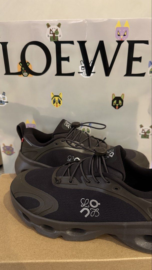 Loewe Cloudsolo Dark Brown/Black (Category: Sneakers) located in Dagupan City. Submitted by gjems_ (Listing ID 1462201862, Image 2). Description: - Authentic Loewe black sneakers - Features iconic white Loewe anagram logo on the side - Secure toggle lace-up closure - Stylish chunky sole design - Ideal for everyday wear and light activities - Comes with original Loewe dust bag.