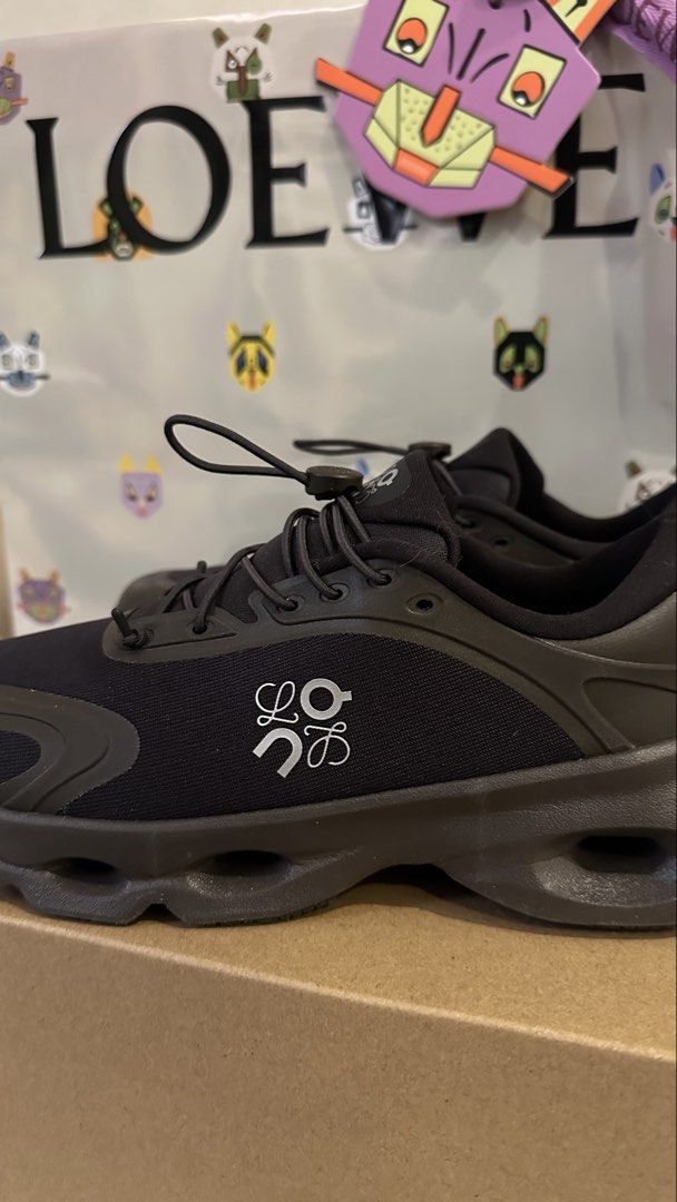Loewe Cloudsolo Dark Brown/Black (Category: Sneakers) located in Dagupan City. Submitted by gjems_ (Listing ID 1462201862, Image 3). Description: - Authentic Loewe black sneakers - Features iconic white Loewe anagram logo on the side - Secure toggle lace-up closure - Stylish chunky sole design - Ideal for everyday wear and light activities - Comes with original Loewe dust bag.