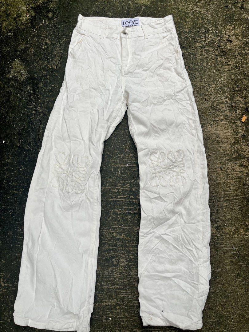LOEWE White Cotton Wide Leg Pants (Category: Other Bottoms) located in Manila. Submitted by shanaaa.collects (Listing ID 1462123988, Image 1). Description: - Brand: LOEWE - Color: White - Fit: Wide leg - Material: 100% Cotton - Features: Iconic LOEWE anagram embroidery on front legs, button and zip closure, leather patch on back - Size: M waist-28/30 lenght-42.